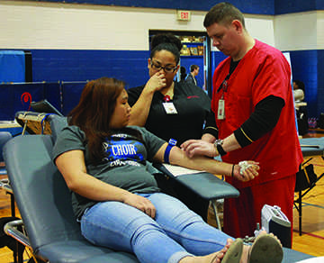 A student from the 2014-2015 school year donating blood. The gift of life is the most precious thing, and if we have the opportunity to give it, that is so important, Terri Cooper, the nurse said. 
