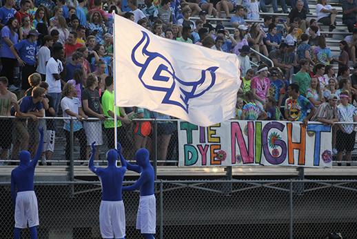 The blue men wave the GE flag after a Blazer touchdown. The Blue Men have been the high school’s unofficial mascots for several years. 