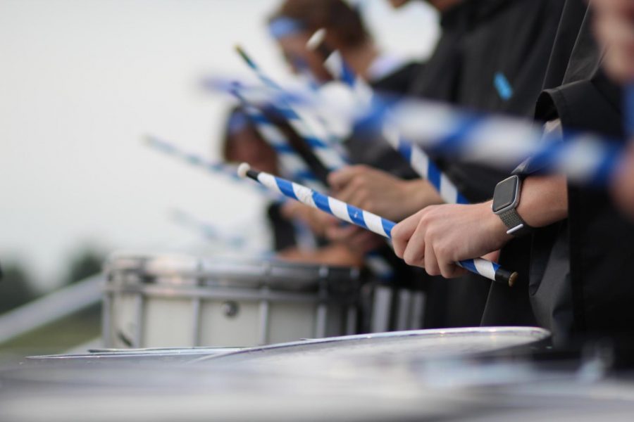 Close view of percussion drumming to the best of their ability.