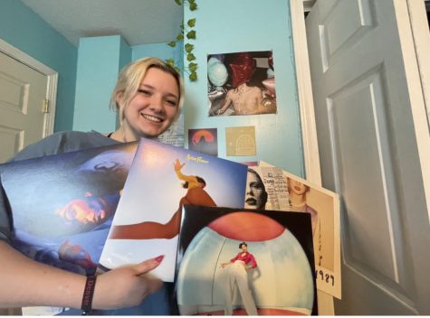 Elyea Soileau with some of her favorite records, including artists Taylor Swift, Harry Styles and Lorde.