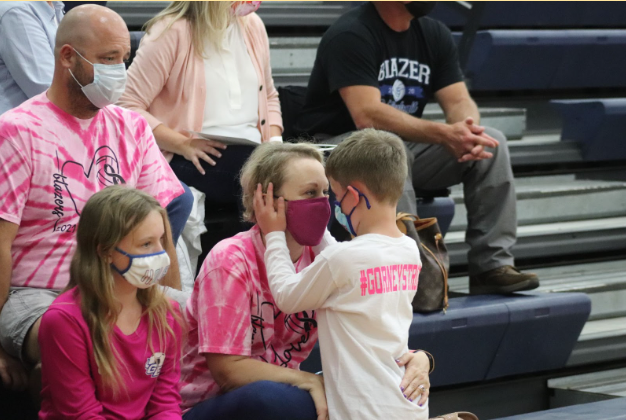 Ashley Gorney with her family at the Dig Pink volleyball game in October.